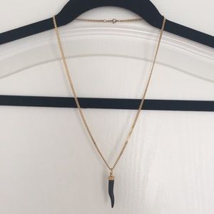 Gold toned necklace with black onyx stone pendant
